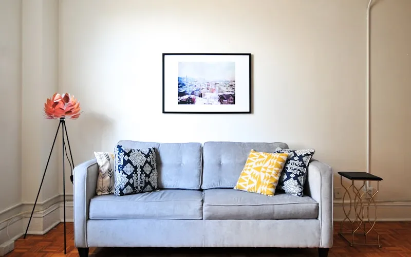 Folding adjustable height desk in small apartment setup, clean and minimal