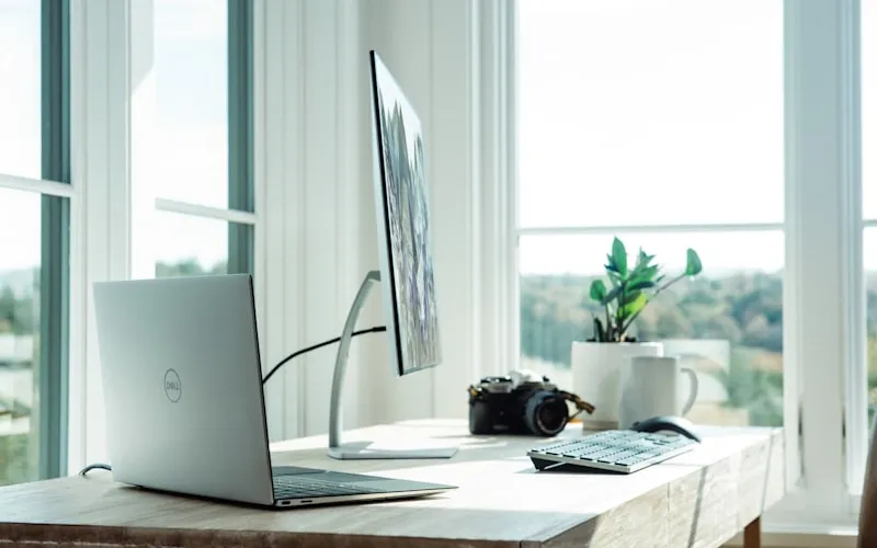 Tabletote portable folding standing workstation with laptop in open plan workspace