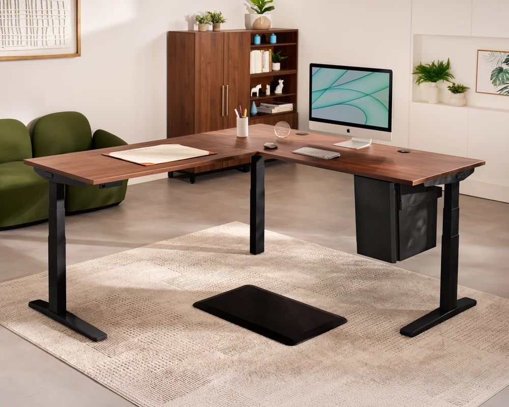 UPLIFT V2 Commercial 3-leg L-shaped electric standing desk in walnut with black steel frame